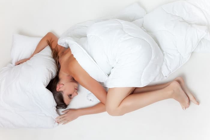 Woman Side Sleeping In Bed