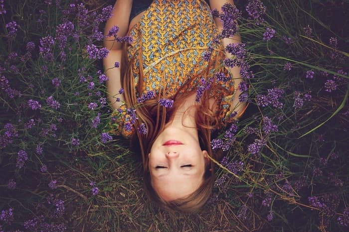 Woman Sleeping On Lavender Plants