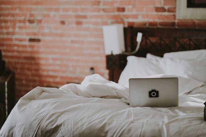 Laptop On White Bedding