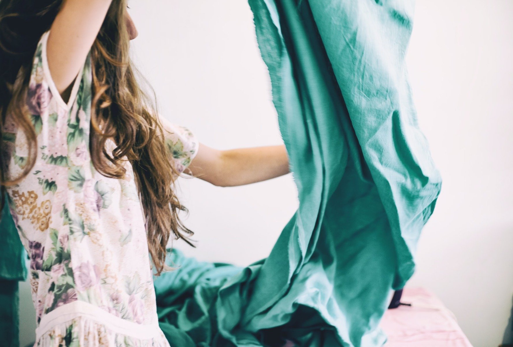 Woman changing bedding