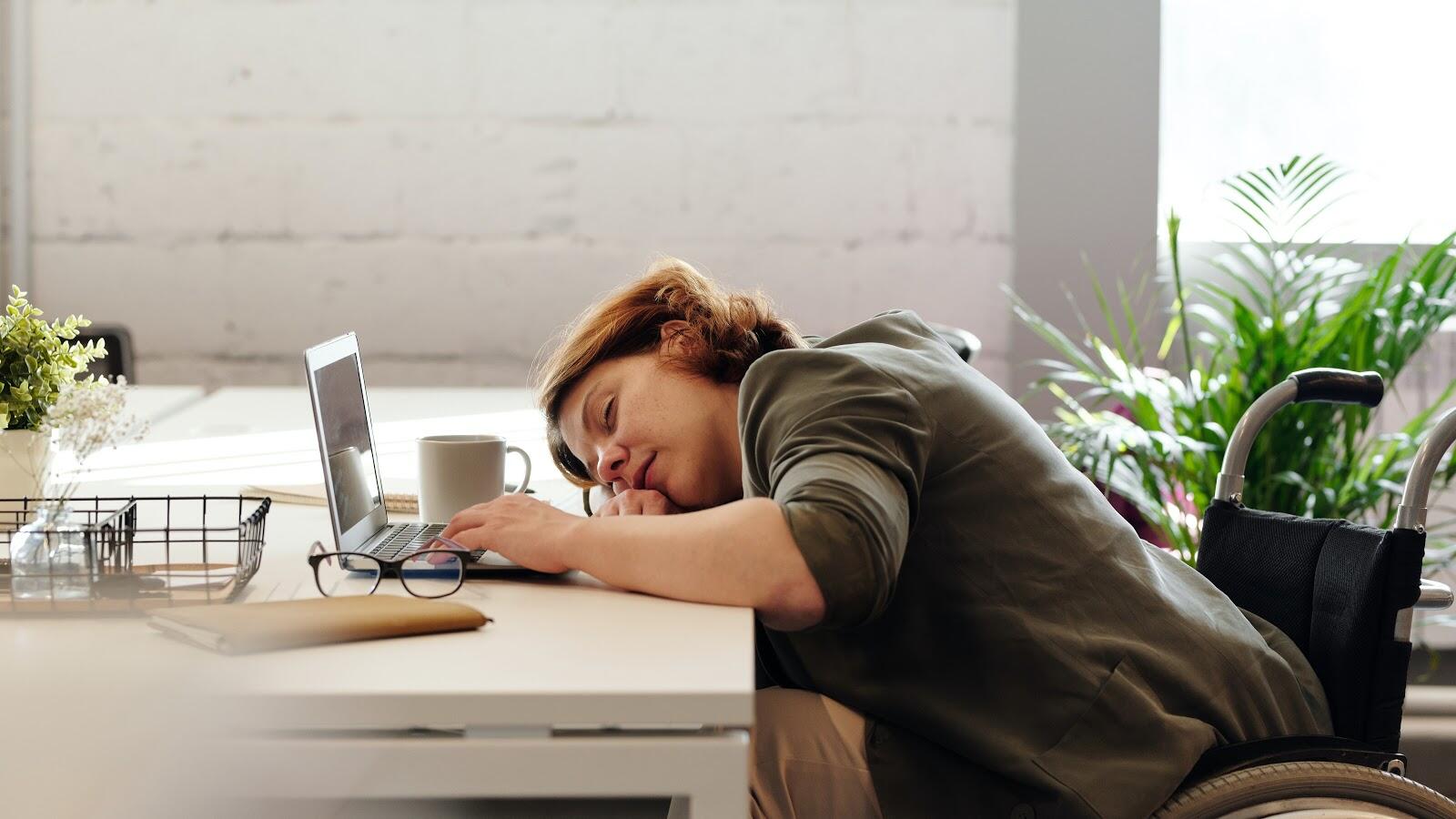 Woman Napping On Desk