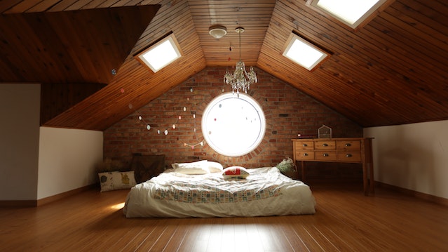 Large bedroom with round window