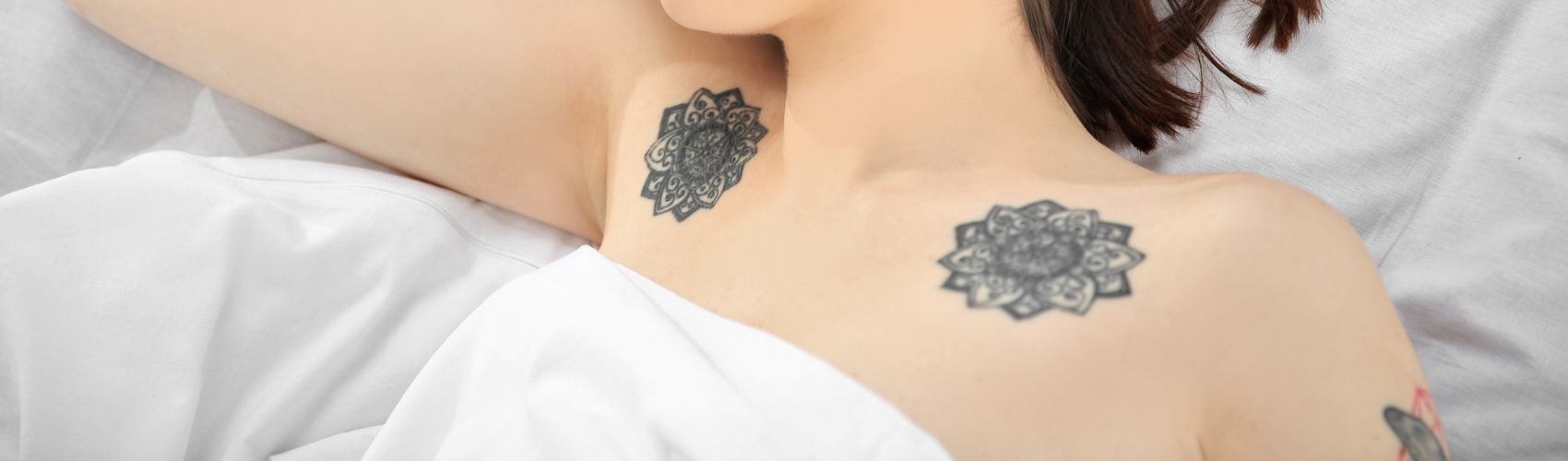 Woman sleeping with tattoos