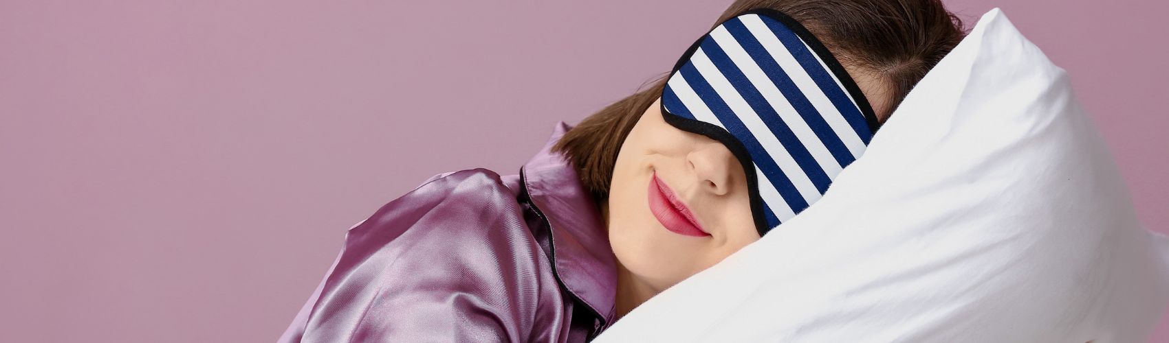 Woman with eye mask sleeping